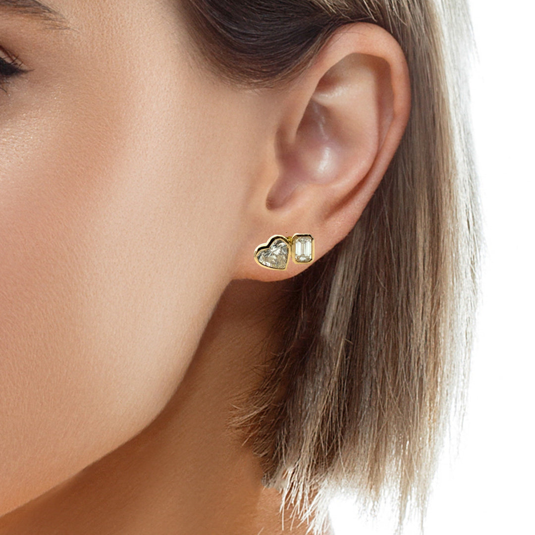 TWO DIAMOND SHAPE BEZEL STUDS
